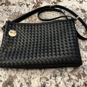 Cross body or shoulder purse. Used once. Adjustable strap.